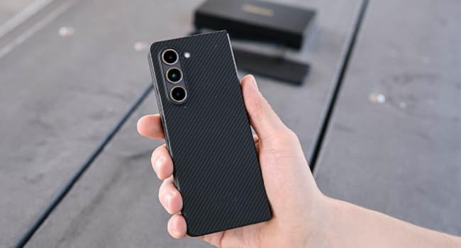 a man takes selfie with galaxy z fold 5 case in aramd fiber case