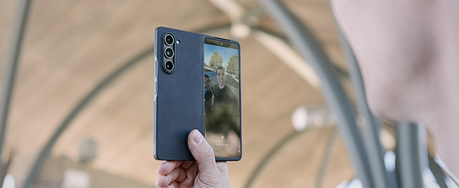 a man takes selfie with galaxy z fold 5 case in aramd fiber case